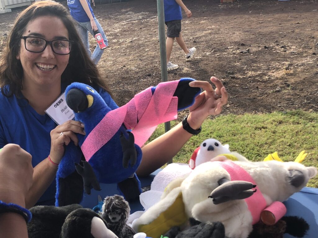 Wildlife Rehabilitator Heidi Franz with wing wrapping activity for children